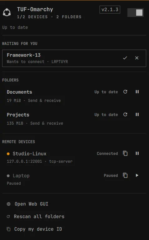 The omasync panel with a pending device invite, two folders and a connected device